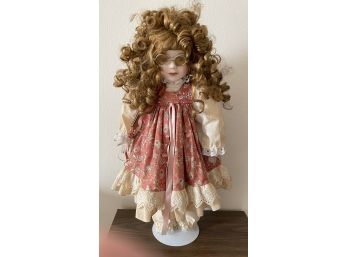 VINTAGE CURLY HAIR PORCELAIN DOLL WITH TINTED SPECS