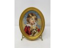 VINTAGE OVAL NEEDLEPOINT WALL HANGING 'GIRL WITH DOG'