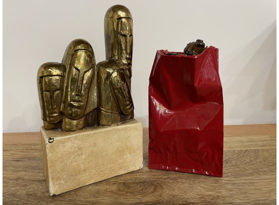 SIGNED ABSTRACT GILT BRONZE SCULPTURE OF FACES ON A CERAMIC BASE AND CERAMIC CHOCOLATE GIFT BAG
