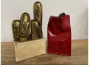 SIGNED ABSTRACT GILT BRONZE SCULPTURE OF FACES ON A CERAMIC BASE AND CERAMIC CHOCOLATE GIFT BAG