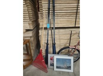 Wooden Oars And Framed Boat Pictures