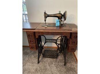 Vintage Singer  Treadle Sewing Machine And Wooden Table Plus Assorted Sewing Accessories.