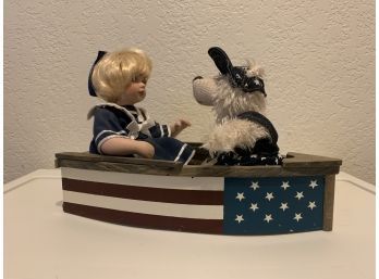 Geppeddo Doll And A Teddy Bear In American Flag Boat
