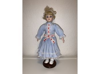 Blonde, Blue Eyed Doll In Light Blue Dress