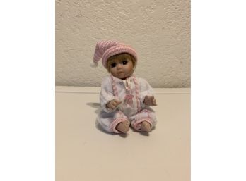 Small Porcelain Baby Doll In Jammies With Cap And Pacifier