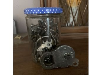 Jar Of Keys And Padlock With Key