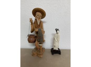 Asian Man And Woman Statues