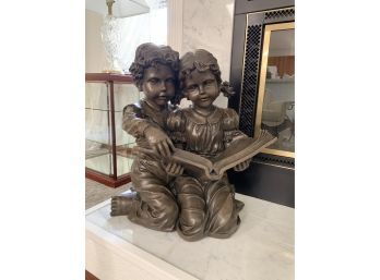 Boy And Girl Reading Music Statue