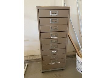 Metal 9 Drawer Storage Cabinet And Its Contents