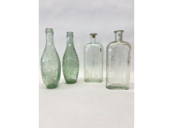 4 Vintage/Antique Embossed Bottles