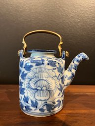 Chinese Porcelain Teapot, With A Cast Brass Handle.