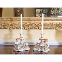 Elegant Pair Of Hand-Painted Porcelain Candlestick Holders With Cherub Design  A Treasured Addition