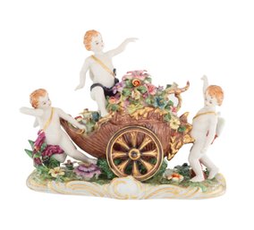 A Cherubic Journey: Exquisite Figurine Of Cherubs In A Wagon