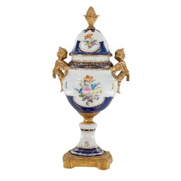 Baroque Elegance: Porcelain Covered Jar With Celestial Cherub Handles