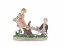Boy And Girl Porcelain Figurine