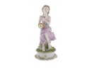 Woman With Flowers Porcelain Figure