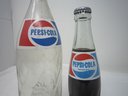 Two Pepsi Cola Bottles