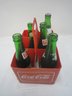 Coke Plastic Caddy And 6 Vintage Bottles