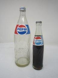 Two Pepsi Cola Bottles