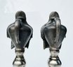 Cast Metal Urns On Pedestals And GlassOrbs