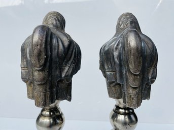 Cast Metal Urns On Pedestals And GlassOrbs