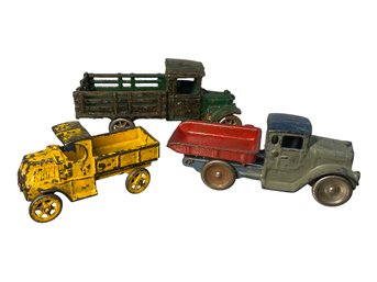 Three Antique Cast Iron Toy Trucks