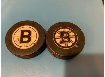Boston Bruins Hockey Pucks, 1 Signed 1 Game Used