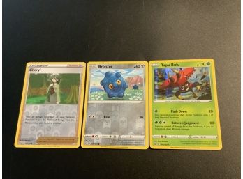 Pokemon Holo Cards Of Tapu Bulu, Bronzor And Cheryl