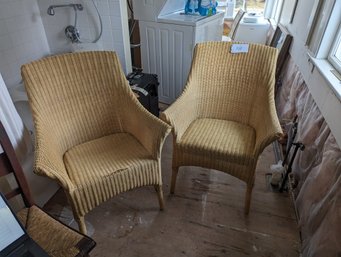 Two Wicker Arm Chairs.