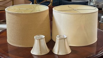 Four Cream And Tan Colored Lamp Shades