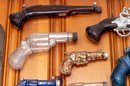 Collection Of Decorative Blown Glass Bottle Firearms
