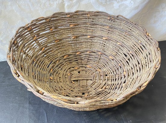 An Antique Woven Centerpiece Basket