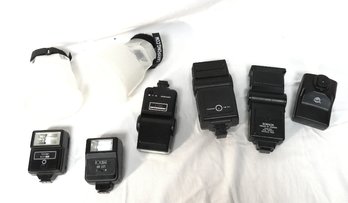 Assorted Flashes And Accessories For Cameras