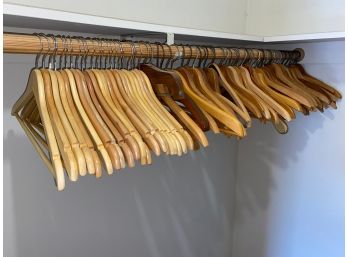 Closet Full Of Vintage Wooden Clothes Hangers.