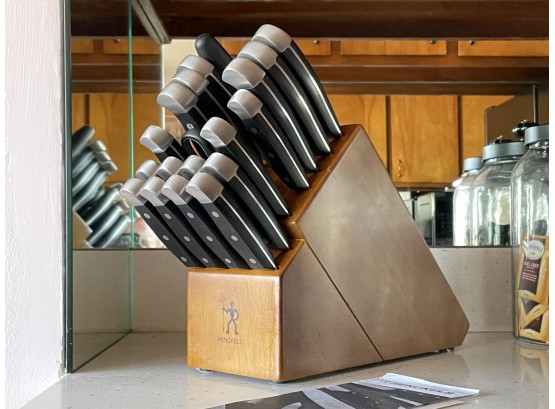 A Henkles Knife Set And Block