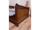 A Full Size Sleigh Bed By ABC Carpet & Home