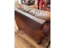 A Comfy Leather Arm Chair By Robinson And Robinson