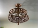 An Elegant Bronze And Crystal Chandelier From Horchow