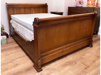 A Full Size Sleigh Bed By ABC Carpet & Home