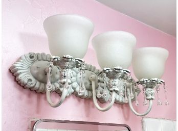A Metal And Frosted Glass Over Vanity Fixture