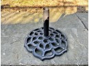 Two Compatible Cast Iron Pierced Outdoor Umbrella Stands