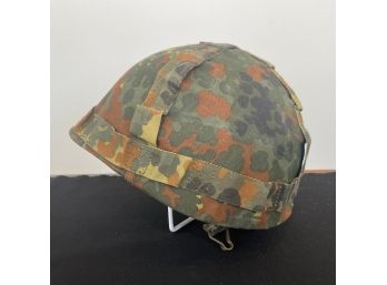 A Vintage US Army Metal Helmet With Cloth Camo Cover And Leather Liner - 55-57