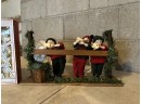 Group Of Christmas Carolers And Ornaments
