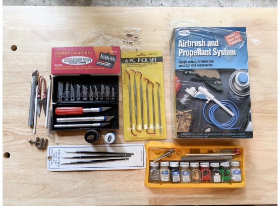 A Nice Group Of Model Building Tools And Paints