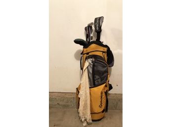 Golf Clubs & Bag Filled With Gear For A Day On The Course
