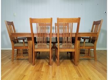 A 20th Century Solid Oak Stickley Style Arts And Crafts Dining Table And Chairs