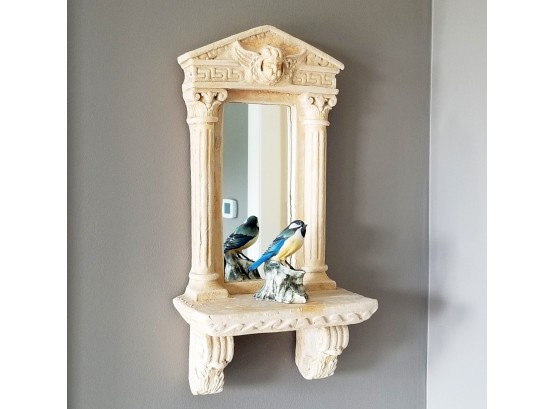 A Cast Stone Mirrored Shelf With Majolica Bird
