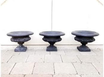 A Trio Of Cast Stone Urns