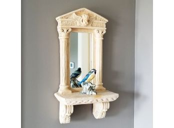 A Cast Stone Mirrored Shelf With Majolica Bird