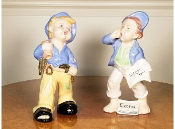 A Pair Of Painted Ceramic 'Newsboy' Figurines